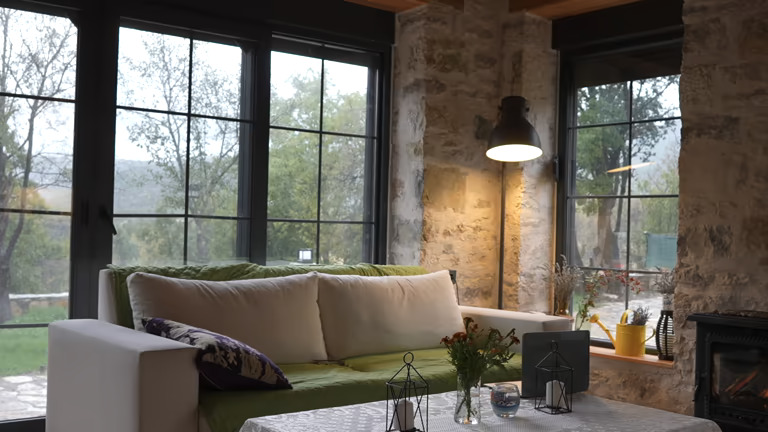 Living room of an old-style rural house in winter windows and doors installation